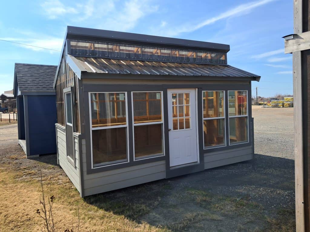 Sunroom with large windows and metal roof, showcasing custom construction by GEMCO Buildings, Inc.