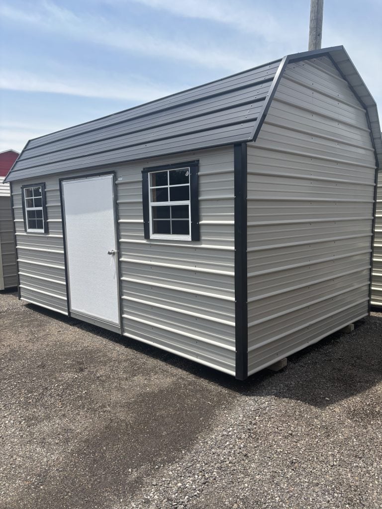 Portable metal building with siding, windows, and a door, designed for commercial or storage use by GEMCO Buildings, Inc.