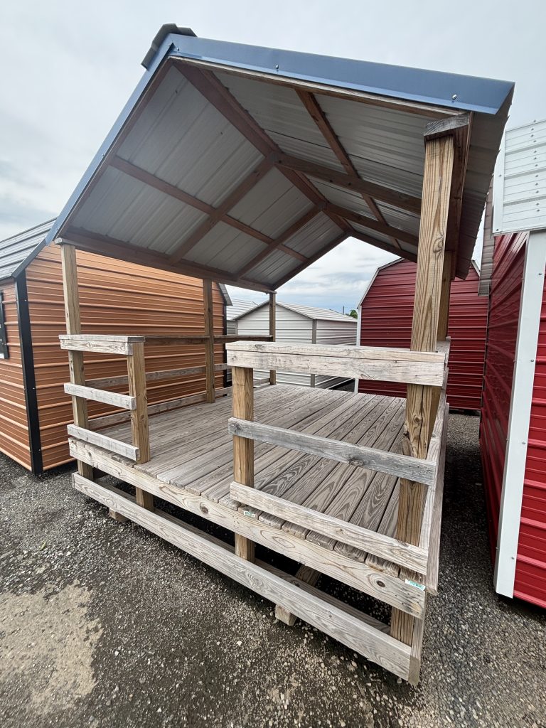 Metal and wood outdoor pavilion with a sloped roof, useful for recreational or commercial purposes, featuring sturdy construction and durable materials, ideal for enhancing outdoor spaces.